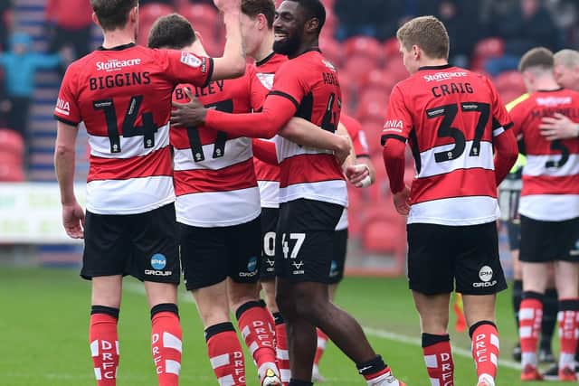 Doncaster's players celebrate Hakkeb Adelakun's goal. Picture:Andrew Roe/AHPIX LTD.