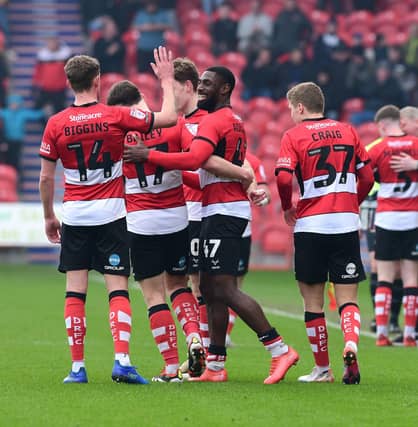 Doncaster's players celebrate Hakkeb Adelakun's goal. Picture:Andrew Roe/AHPIX LTD.