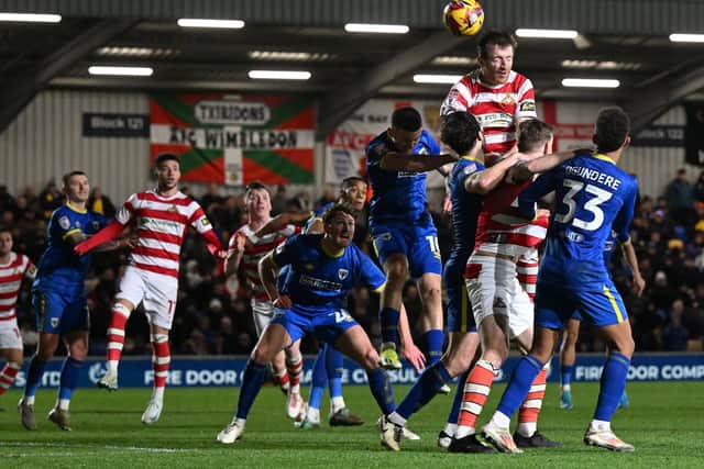 Picture Howard Roe/AHPIX LTD; Football, SkyBet; League Two; 
AFC Wimbledon  v Doncaster Rovers;
14/12/2024 3.00pm KO
Doncasters'  Tom Anderson flicks the throw in on