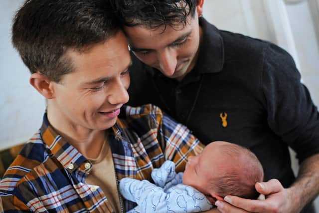Adam Williams and Harvey Cooper, pictured with their son Jacob. Picture: NDFP-09-02-21-HarveyAdam 3-NMSY