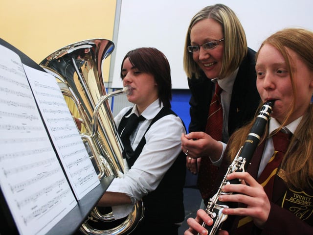 Joanna Mather, of Balby Carr College, Laura Boyle of the Reg Vardy Band and Rebecca Scorer, of Trinity Academy, enjoy the musical workshop.