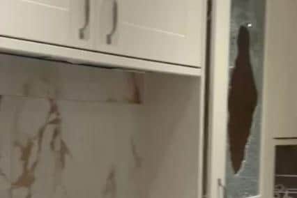 Glass fronted kitchen cabinets were smashed.