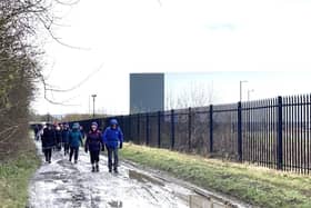 Along side the iPort fence