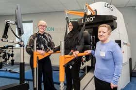 Square One Law’s Merissa Galley and Sarah Daniel of MOTIONRehab with client and new equipment.