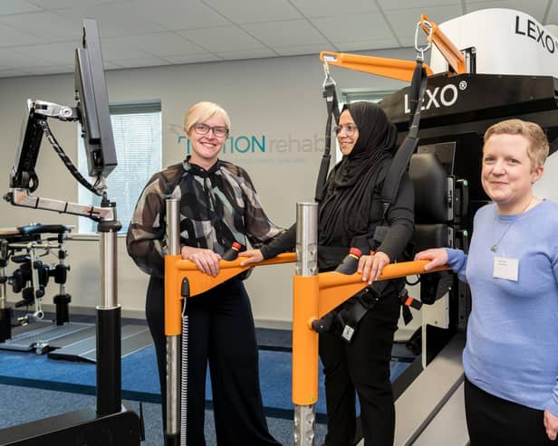 Square One Law’s Merissa Galley and Sarah Daniel of MOTIONRehab with client and new equipment.