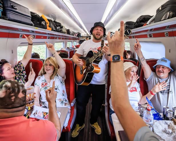 Fans pictured singing along to some Oasis classics sung by Keiran La Fox on board the Oasis-themed LNER service to London.