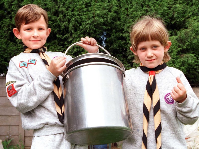 Thanks to the fund-raising efforts of Scouts, Venture Scouts, Cubs and Beavers the 32nd (Armthorpe) Doncaster Scout Group was able to buy some new outdoor cooking equipment. Our picture shows Beavers Andrew Hodby, aged eight, and Joanne Pratt, aged six, with a dixie - that's a cooking pot to non-scouting types, June 1998