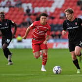 Rotherham United's Kieran Sadler takes on Doncaster's Charlie Seaman in the Papa John's Trophy last season.