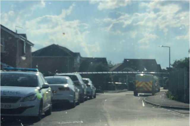 Police sealed off Thorpehall Road after shots were fired at a house.