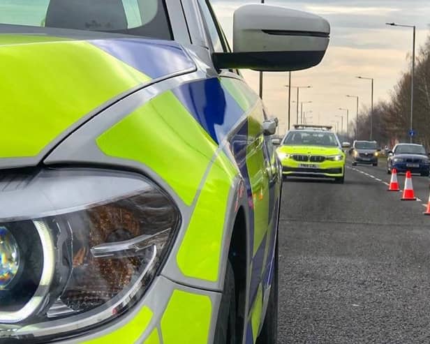 A 56-year-old man is in a critical condition after his bike smashed into a police car in Doncaster.