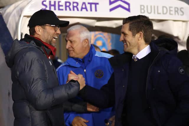 Sam Ricketts, manager of Shrewsbury Town, shakes hands with Liverpool's Jurgen Klopp during their sides' FA Cup fourth round clash last month. (Photo by Catherine Ivill/Getty Images)
