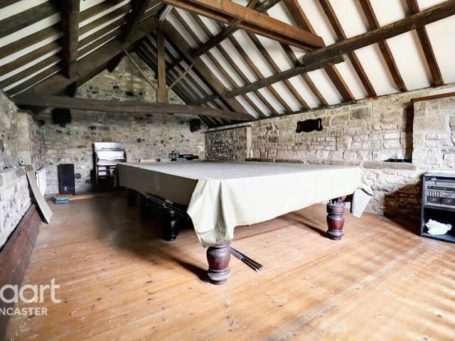 The billiard room is above the double garage.