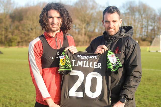 New Doncaster Rovers signing Todd Miller with head coach Danny Schofield. Photo: Heather King/Doncaster Rovers.