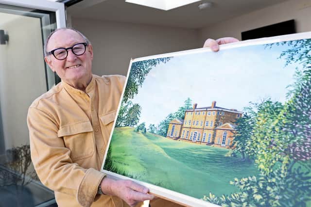 John, holds a painting of Cusworth Hall.