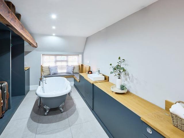 A stylish bathroom with window seat.