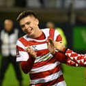 Patrick Kelly in jubilant mood after scoring the match-winner at Barrow.