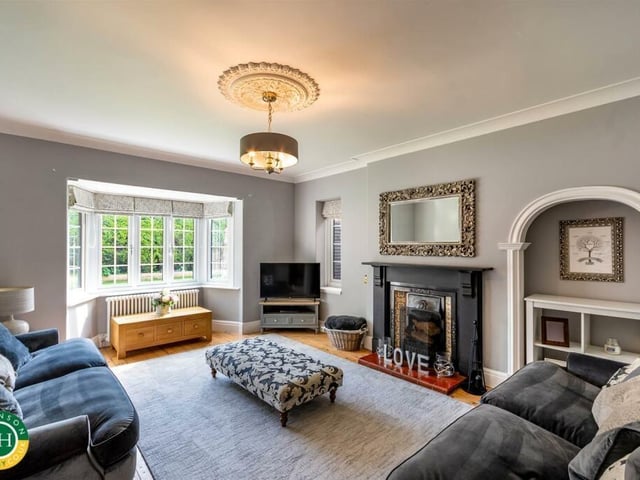 The bay-fronted lounge, with feature fireplace.
