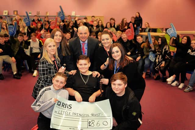 Kobi Laybourne, 11, pictured with Libby Clark, 12, Kenzy Bennett, 15, Charlene Smith, Barber, John Higgins, Principal, Michelle Wilkinson, Year seven learning mentor, and his mum Kelly Laybourne.