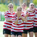The ladies celebrating scoring in one of their games.