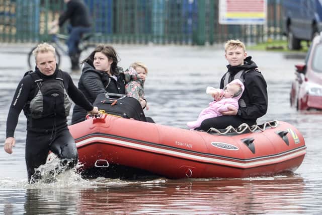 Residents on Yarborough Terrace in Doncaster are rescued from their homes as flood waters rise in the area following heavy rain