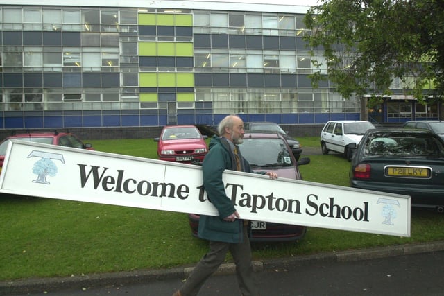 Deputy head  Richard Storer was seen he carrying the old school sign away to be fitted at the new school building in 2001