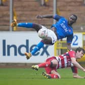 Joe Wright slide to win the ball from Carlisle's Gime Toure. Picture: Steve Flynn/AHPIX
