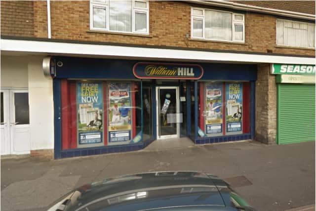 The robbery took place outside the William Hill branch in Beckett Road.