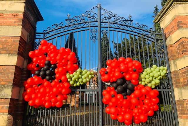 Giant poppy balloon display adorns gates of Bawtry Hall