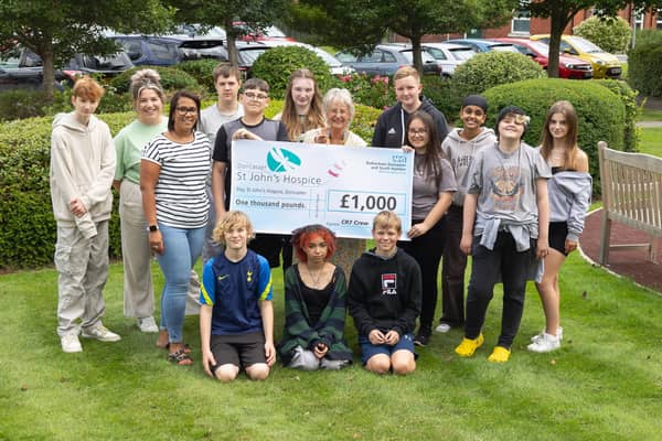 XP Students are pictured with Teacher, Hayley Ibbotson (middle row, far left) and Maureen Harwood, hospice fundraiser (middle row, centre).