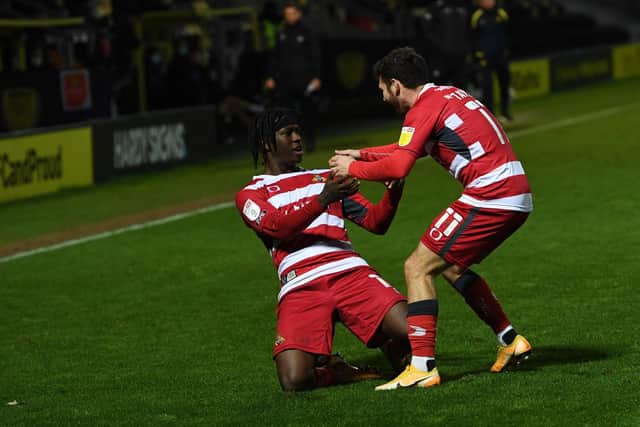 Taylor Richards celebrates his goal at Burton with Jon Taylor. Picture: Howard Roe/AHPIX
