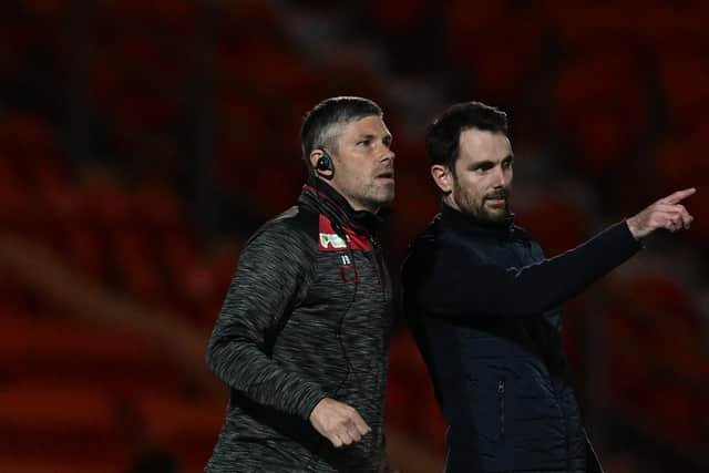 Ian Bennett (left) and Danny Schofield on the touchline.