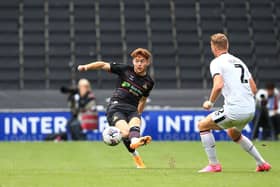 Doncaster Rovers' Jack Senior clips the ball forward.