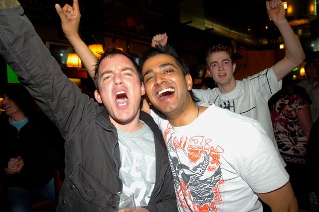 Fans Paul Groom and Manny Singh celebrating Doncasters victory.