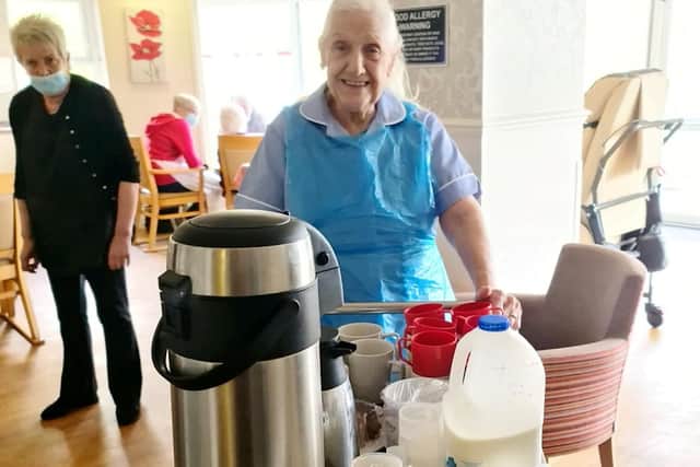 Maureen Townend on the tea run. An 83-year-old care home resident has volunteered to work as a care assistant at her own home to help out staff. See SWNS story SWLEcarer. Maureen Townend expressed to staff at Flower Park Care Home in Doncaster, South Yorkshire, where she is a resident, how much she would like to be a care assistant. After haggling with carers, the care home finally allowed the caring OAP to work as a volunteer amongst her friends and other residents.