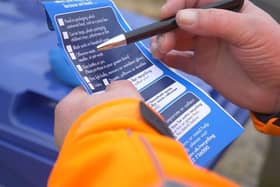 The blue tags that will be placed on recycling bins where the wrong items have been disposed of