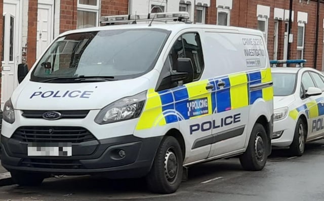 Police vehicles respond to a crime