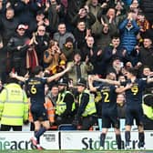 Bradford's Andy Cook celebrates his goal in front of the travelling fans.