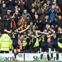 Bradford's Andy Cook celebrates his goal in front of the travelling fans.