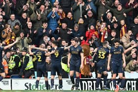 Bradford's Andy Cook celebrates his goal in front of the travelling fans.