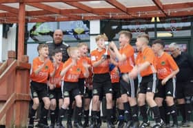 Doncaster Schools Football Association under-11s have completed a remarkable double - going the whole season unbeaten.