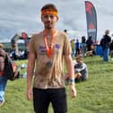 100081 – Tom Hill after finishing the Tough Mudder challenge