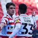 Doncaster's Harrison Biggins celebrates his goal with Ben Close.