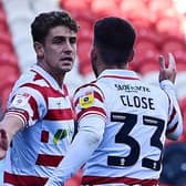 Doncaster's Harrison Biggins celebrates his goal with Ben Close.