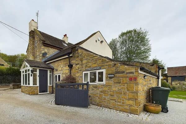 The attractive exterior of the four-bedroom cottage for sale in High Melton