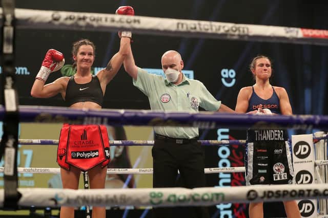 Terri Harper has her arm raised in victory. Photo: Mark Robinson/Matchroom Boxing