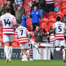 Doncaster's players celebrate Kyle Hurst's goal against Crawley Town last time out.