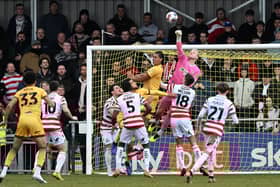 Jonathan Micthell punches clear under pressure.