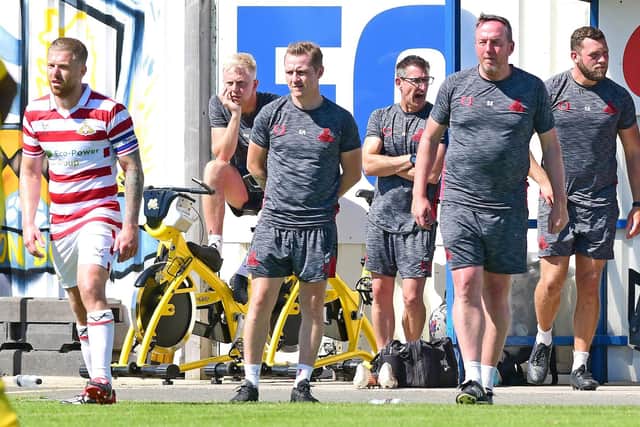 Gary McSheffrey (centre) and Rovers' backroom staff. Photo: Andrew Roe/AHPIX LTD.