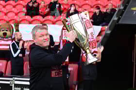Rovers boss Grant McCann with the fruits of his labour: the League Two trophy.
