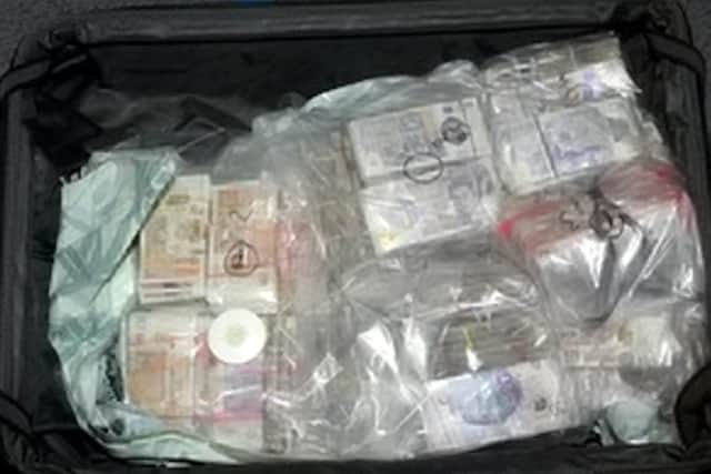 One of the five suitcases full of cash.